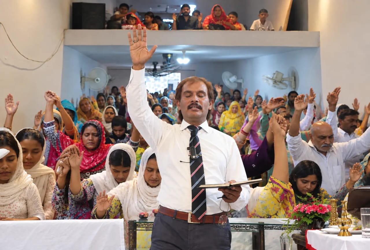 Church members taking notes during Biblical teaching at Church of Christ Assembly in Pakistan