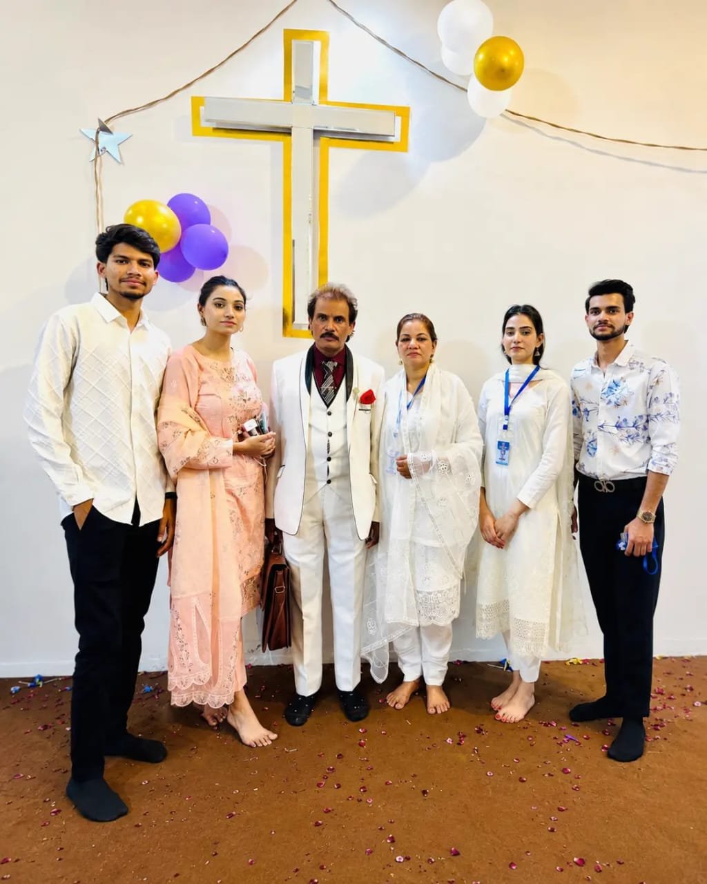 Church family sharing fellowship and community life at Church of Christ Assembly in Pakistan
