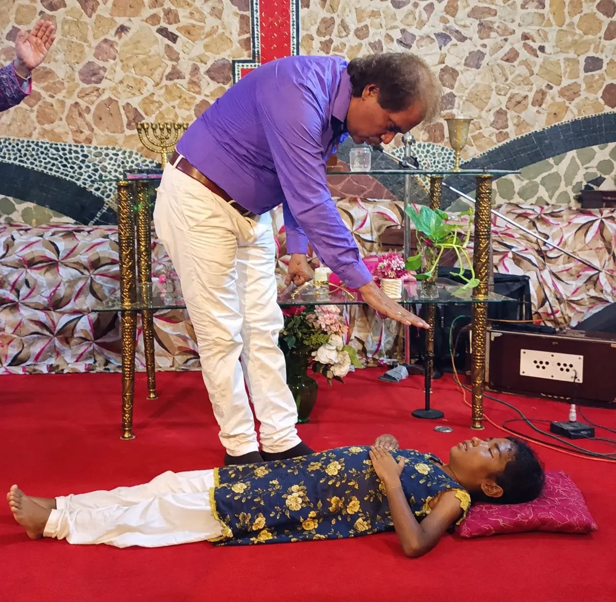 Church member sharing a testimony of transformation at Church of Christ Assembly in Pakistan