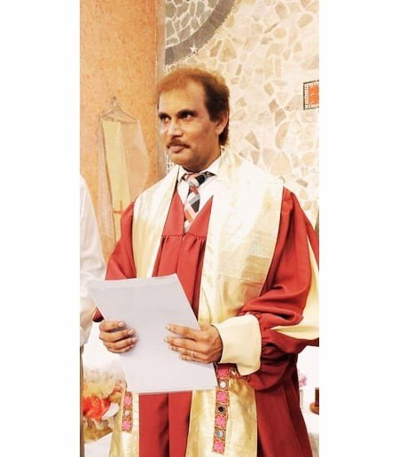 Lead Pastor Yousaf Hussain in official ministry robes Church of Christ Pakistan